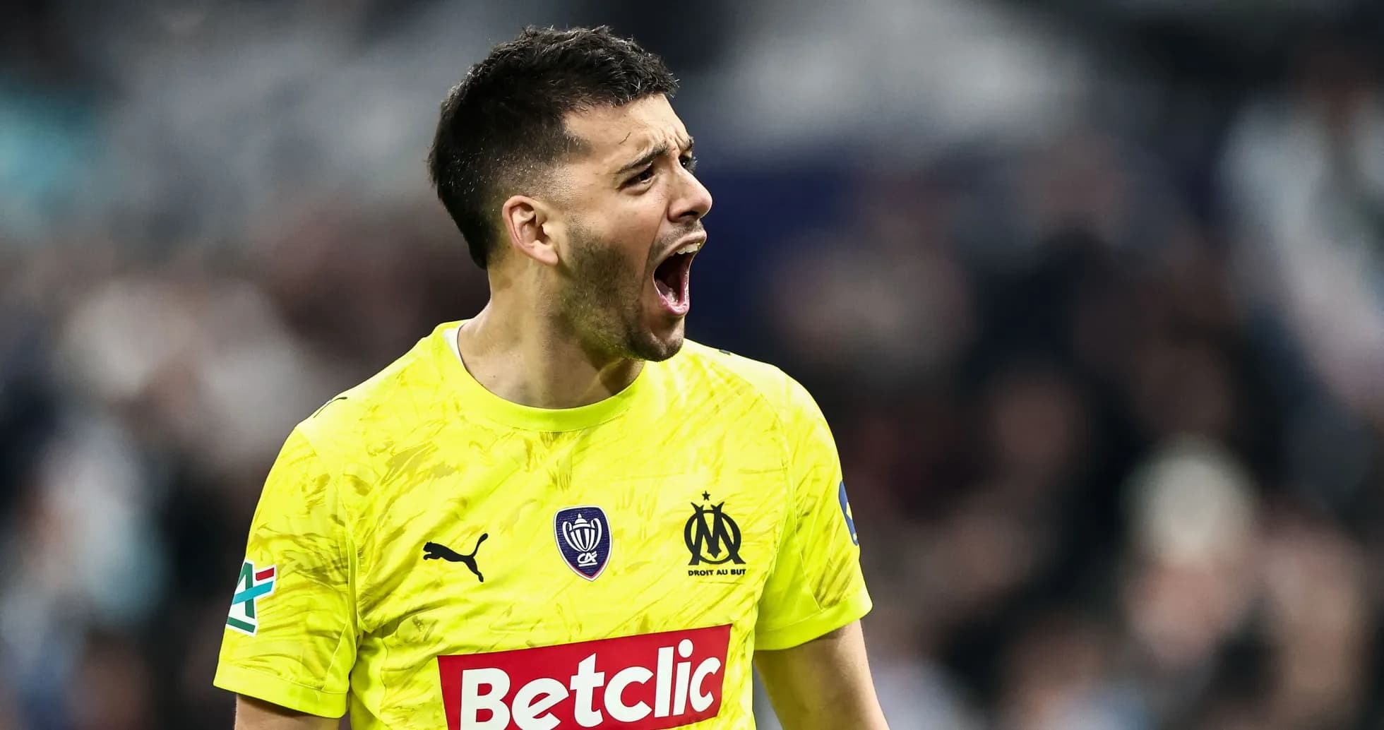 Goalkeeper celebrating during a match for Marseille Goalkeeper celebrating during a match for Marseille