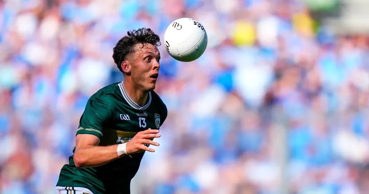 Player catching a football during a match Player catching a football during a match