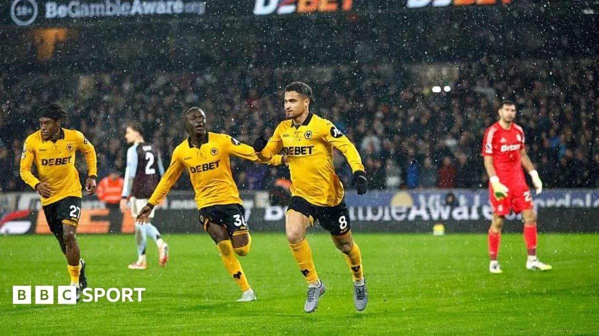 Player celebrating goal with teammates during match Player celebrating goal with teammates during match