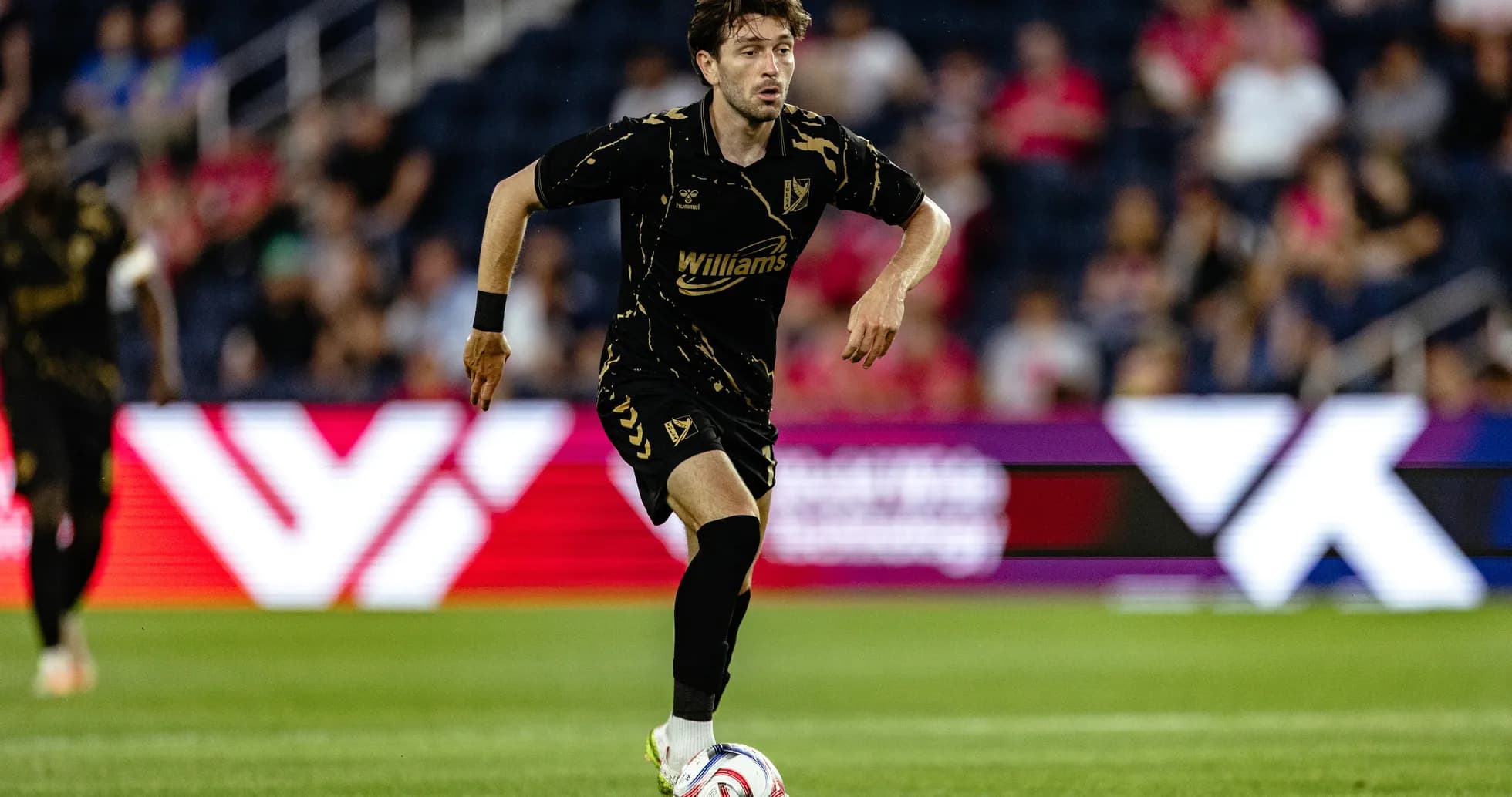 Player dribbling the ball during match Player dribbling the ball during match