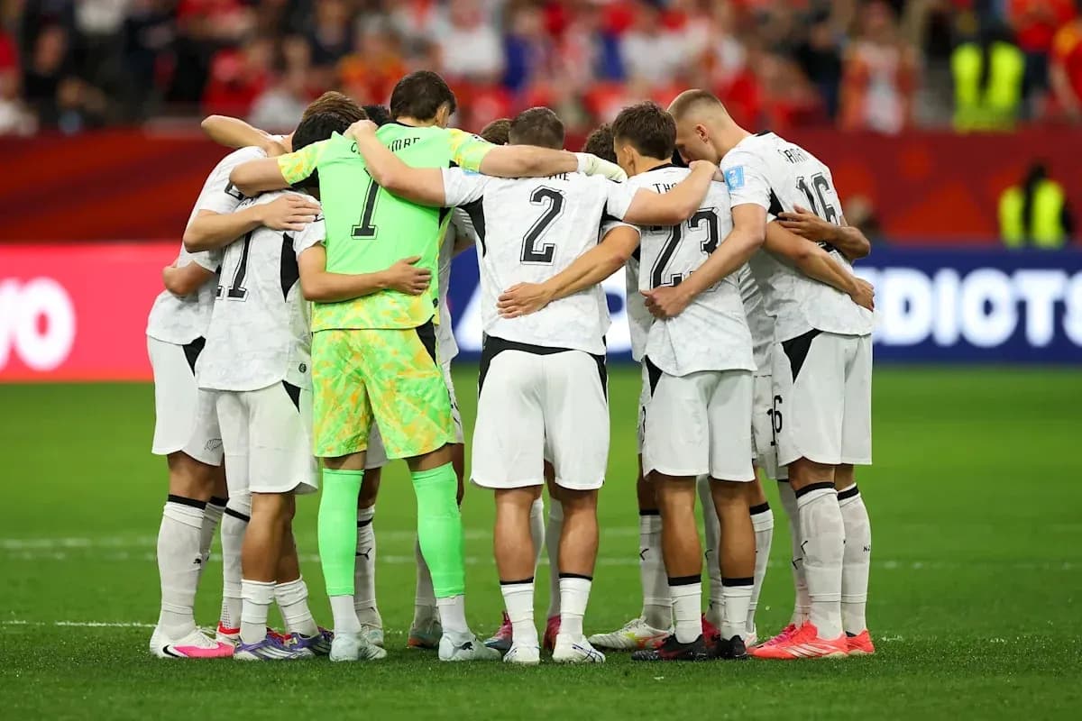 Players huddled together before the match Players huddled together before the match