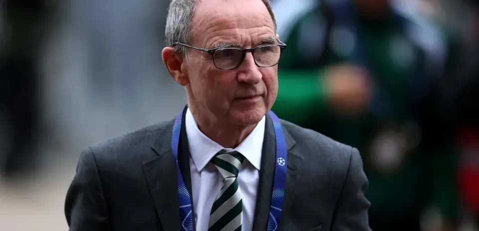 Man in suit with glasses entering stadium Man in suit with glasses entering stadium