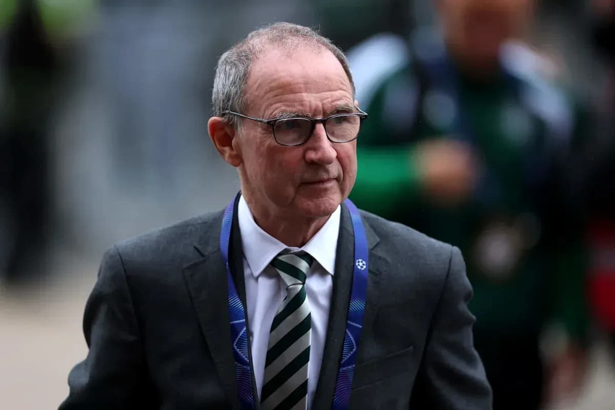 Man in suit with glasses entering stadium Man in suit with glasses entering stadium