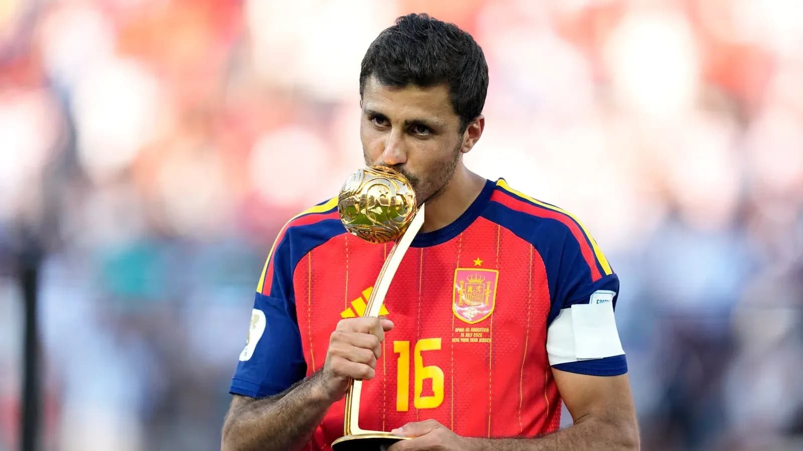 Player kissing trophy after winning tournament Player kissing trophy after winning tournament