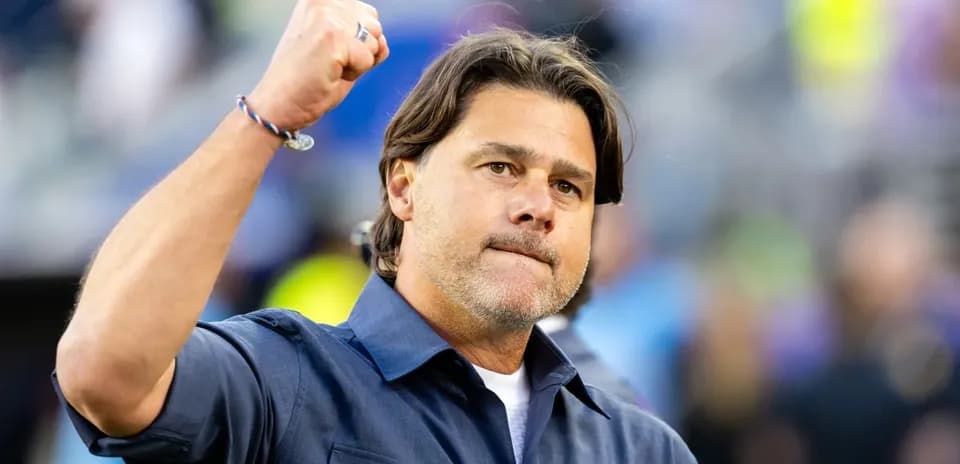 Coach celebrating with a raised fist during match Coach celebrating with a raised fist during match