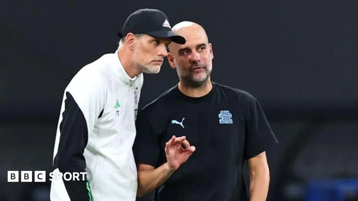 Two football coaches discussing strategies on the pitch Two football coaches discussing strategies on the pitch