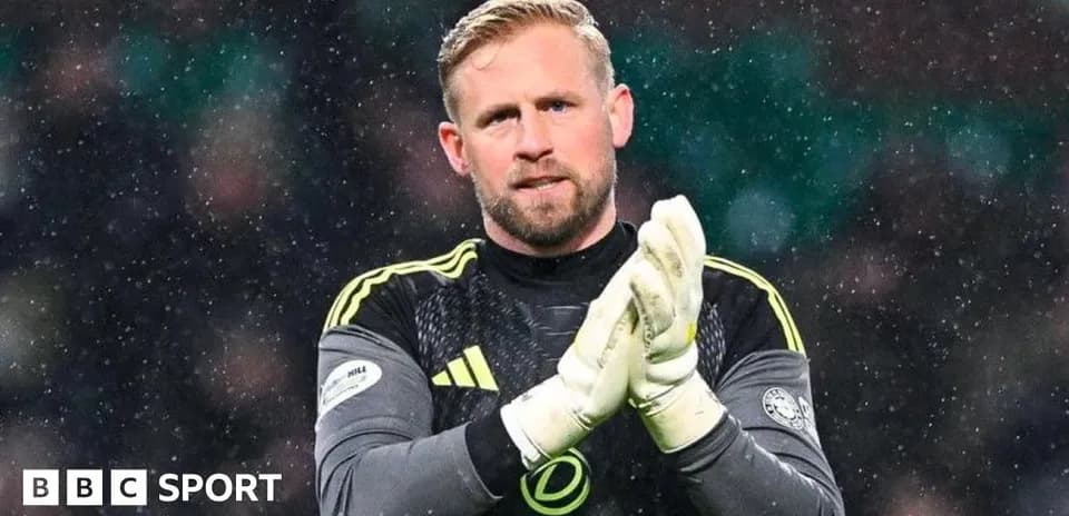 Goalkeeper clapping hands during snowy match Goalkeeper clapping hands during snowy match