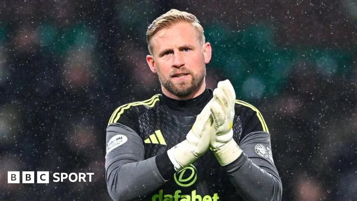 Goalkeeper clapping hands during snowy match Goalkeeper clapping hands during snowy match