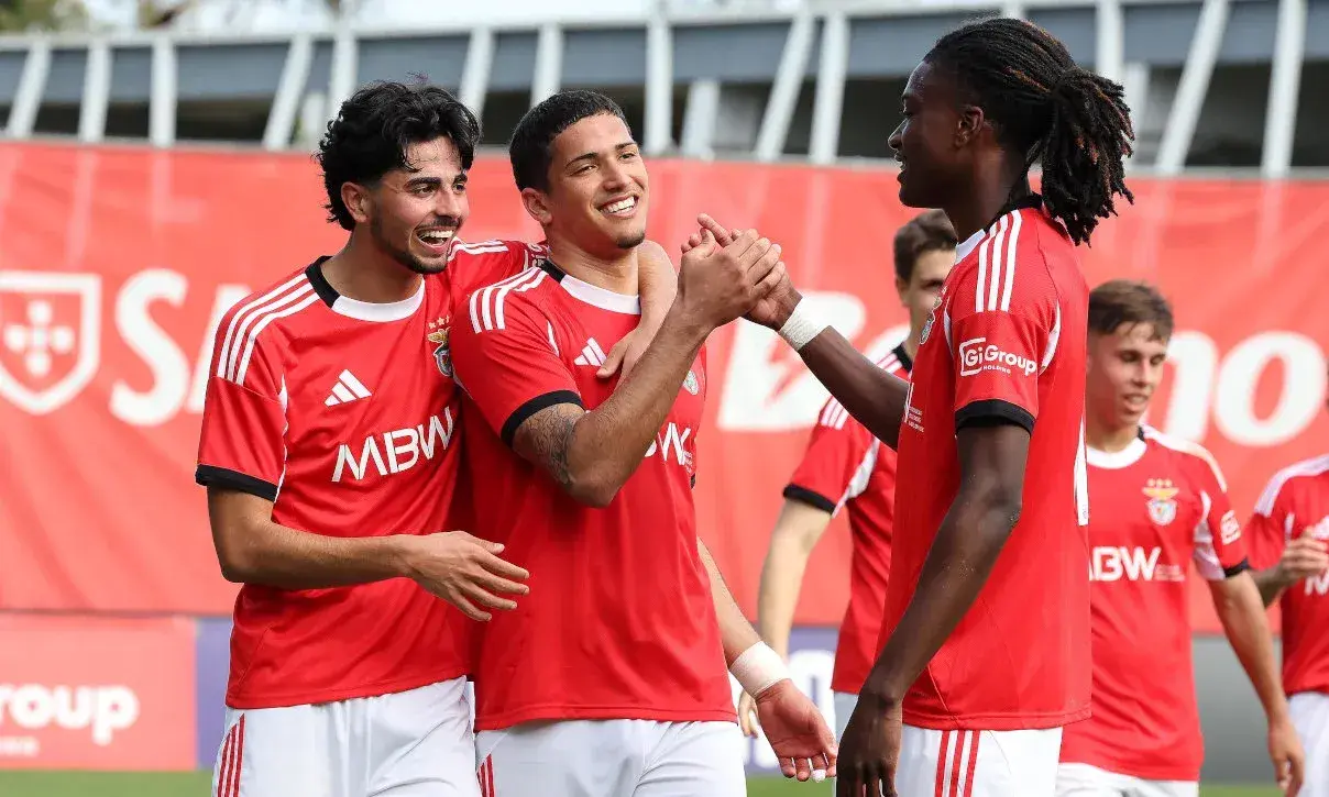 Benfica players celebrating a goal together Benfica players celebrating a goal together