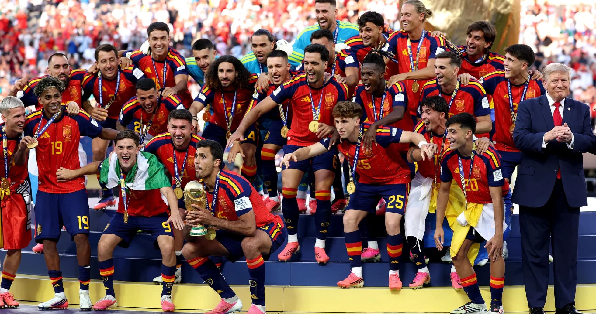 Spain national team celebrating World Cup victory on podium Spain national team celebrating World Cup victory on podium