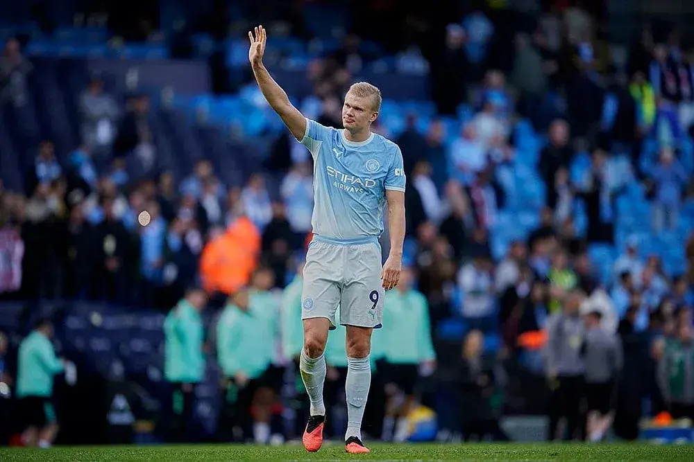 Manchester City player waving to the crowd Manchester City player waving to the crowd