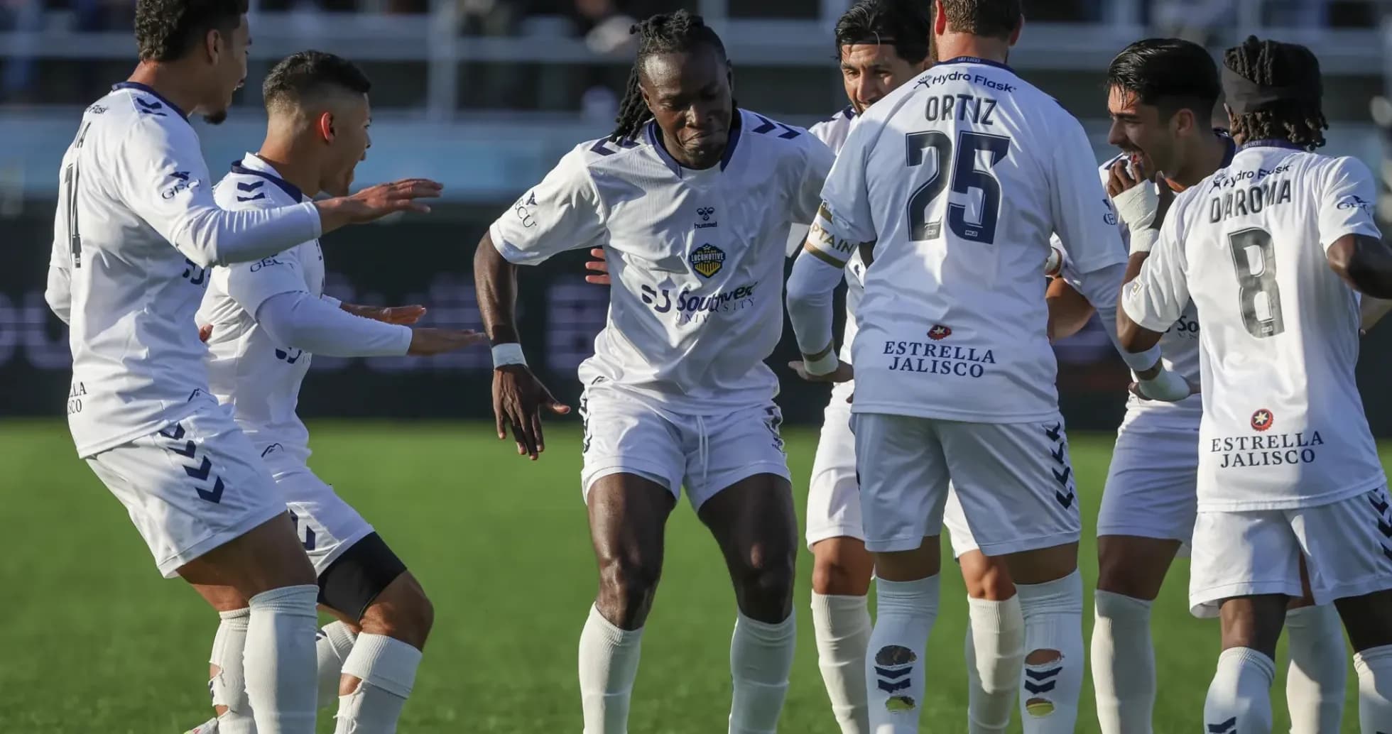 Players celebrating a goal during match Players celebrating a goal during match