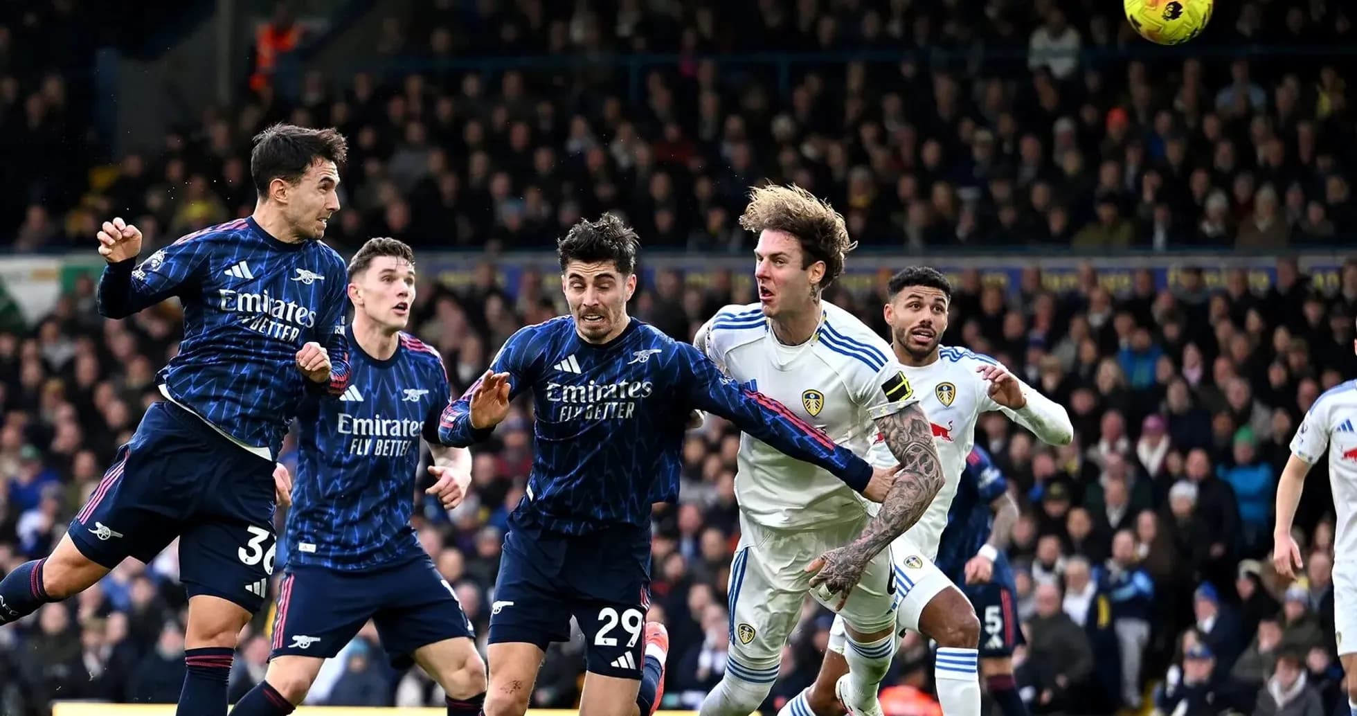Players contesting the ball during Arsenal vs Leeds match Players contesting the ball during Arsenal vs Leeds match