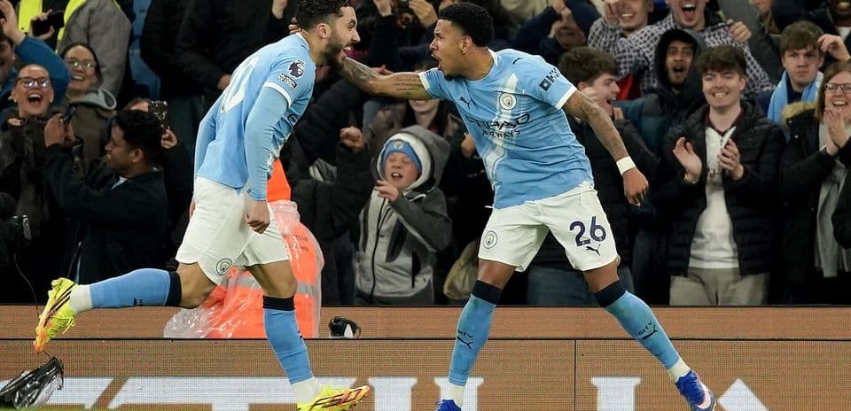 Manchester City players celebrating a goal Manchester City players celebrating a goal