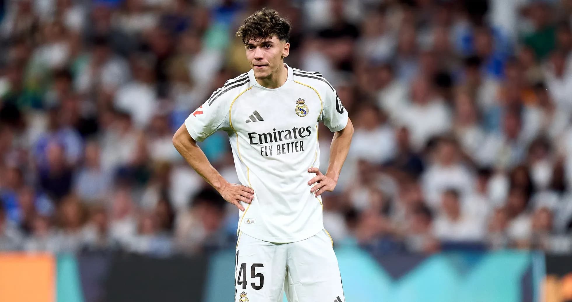 Player wearing Real Madrid kit on the field Player wearing Real Madrid kit on the field