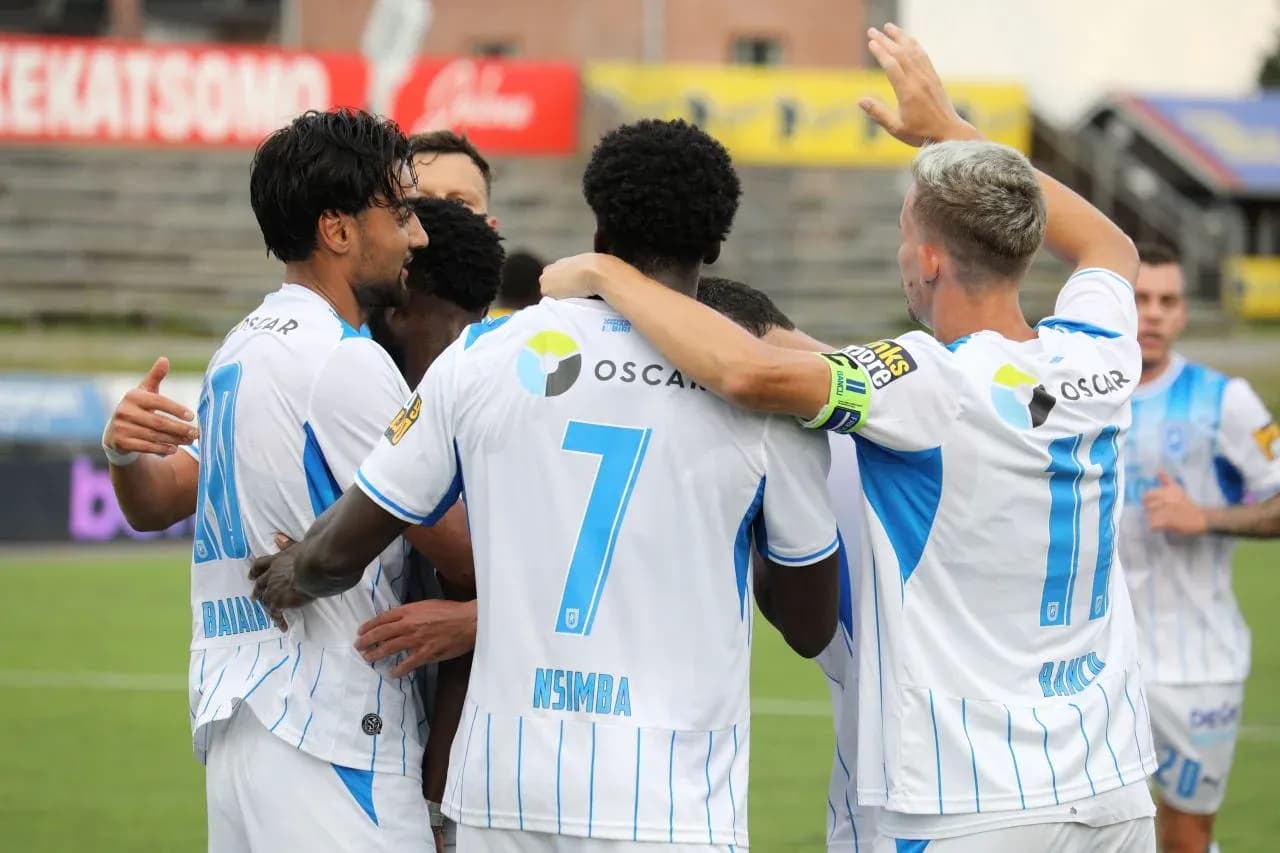 Players celebrating a goal during match Players celebrating a goal during match