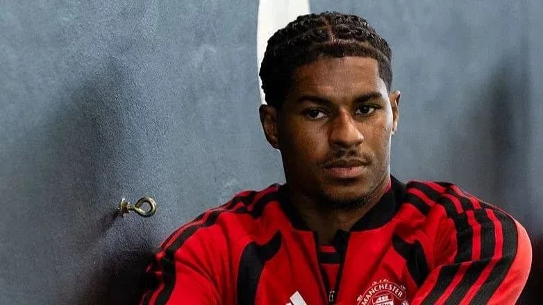 Player in Manchester United training gear posing Player in Manchester United training gear posing