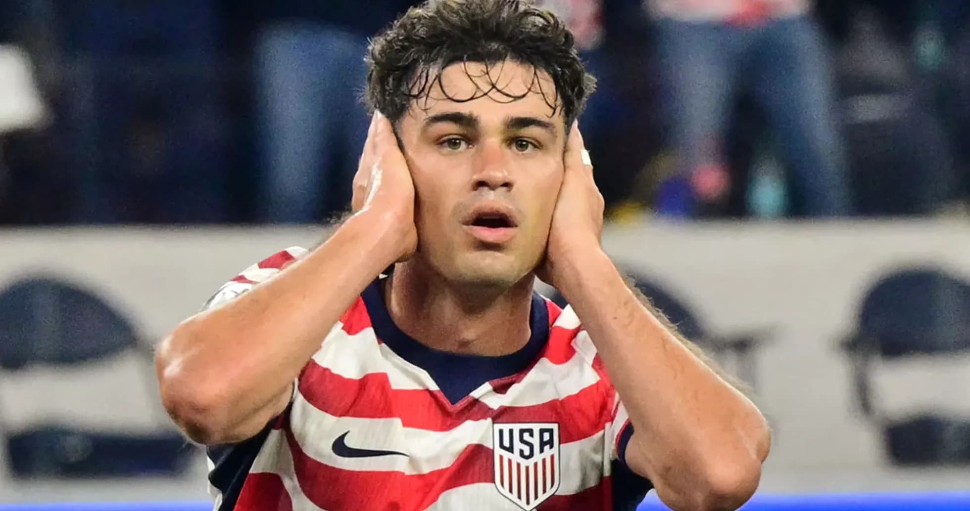 Player reacting during a match wearing USA jersey Player reacting during a match wearing USA jersey