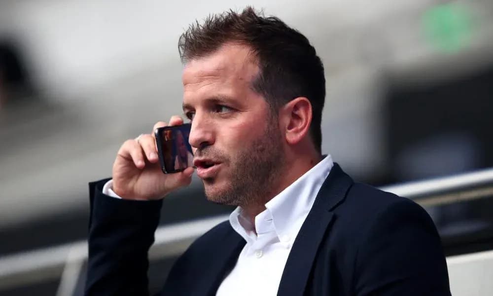 Man talking on the phone in stadium seating Man talking on the phone in stadium seating