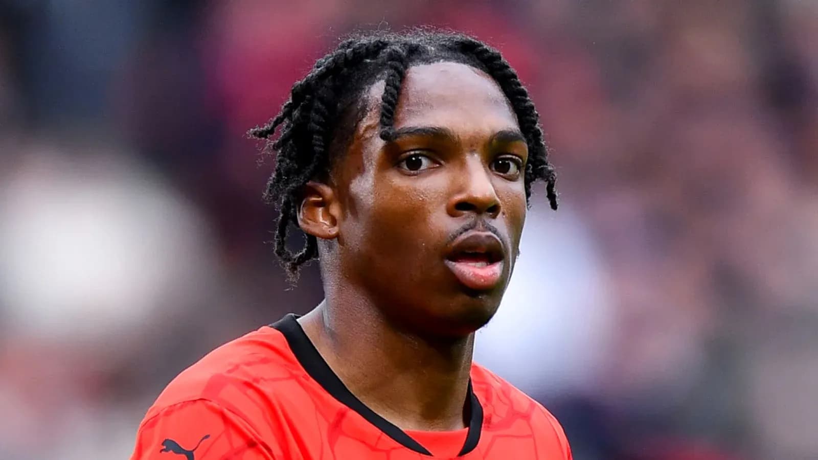 Player wearing red jersey during a match Player wearing red jersey during a match