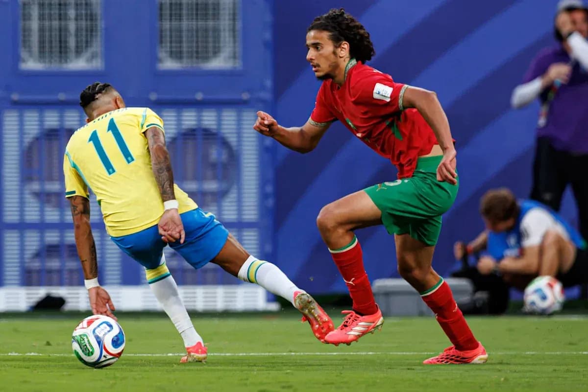Player dribbling the ball during a match Player dribbling the ball during a match