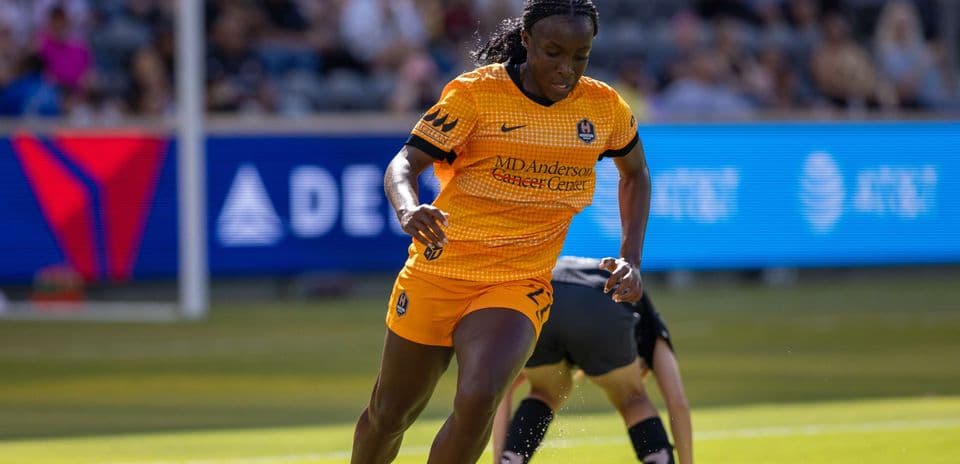 Houston Dash player running during match Houston Dash player running during match