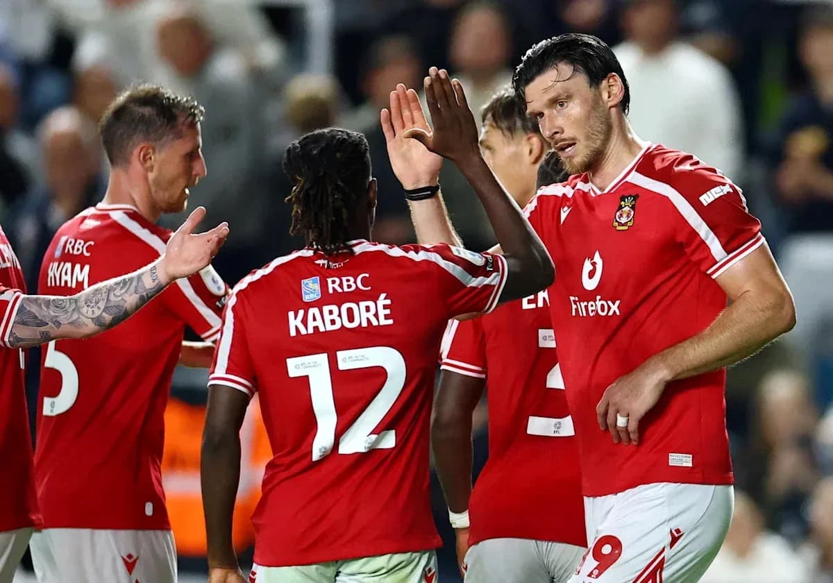 Players celebrating after scoring during a match Players celebrating after scoring during a match
