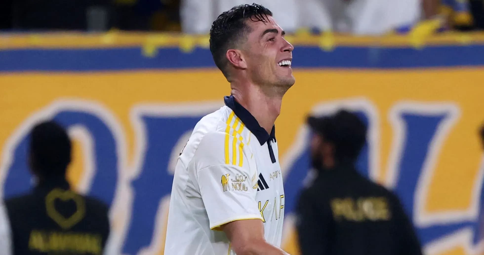 Player celebrating on the field after scoring Player celebrating on the field after scoring