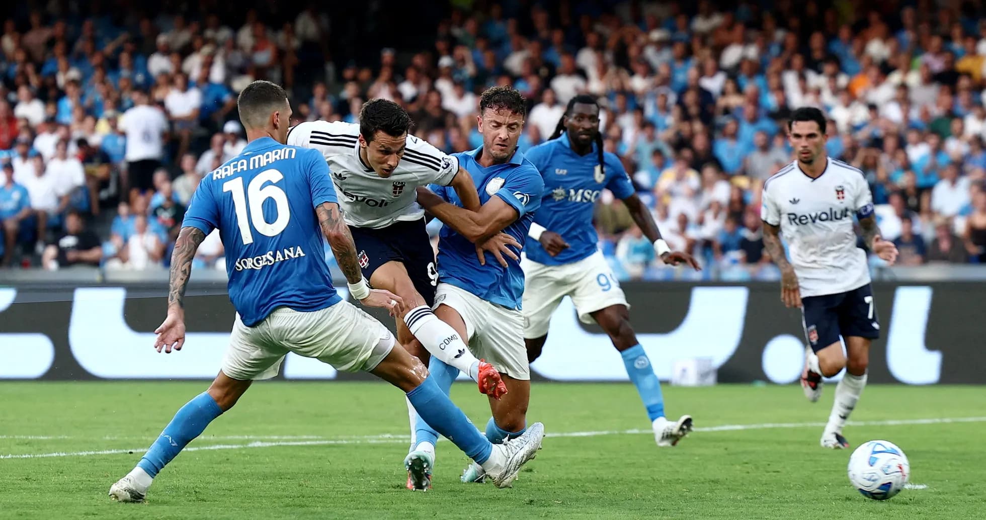 Players competing for the ball in Serie A match Players competing for the ball in Serie A match