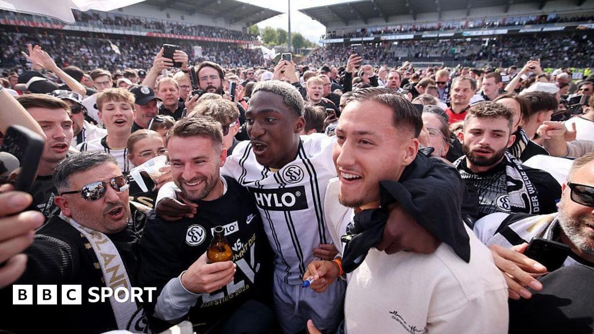 Fans celebrating with players after a match Fans celebrating with players after a match