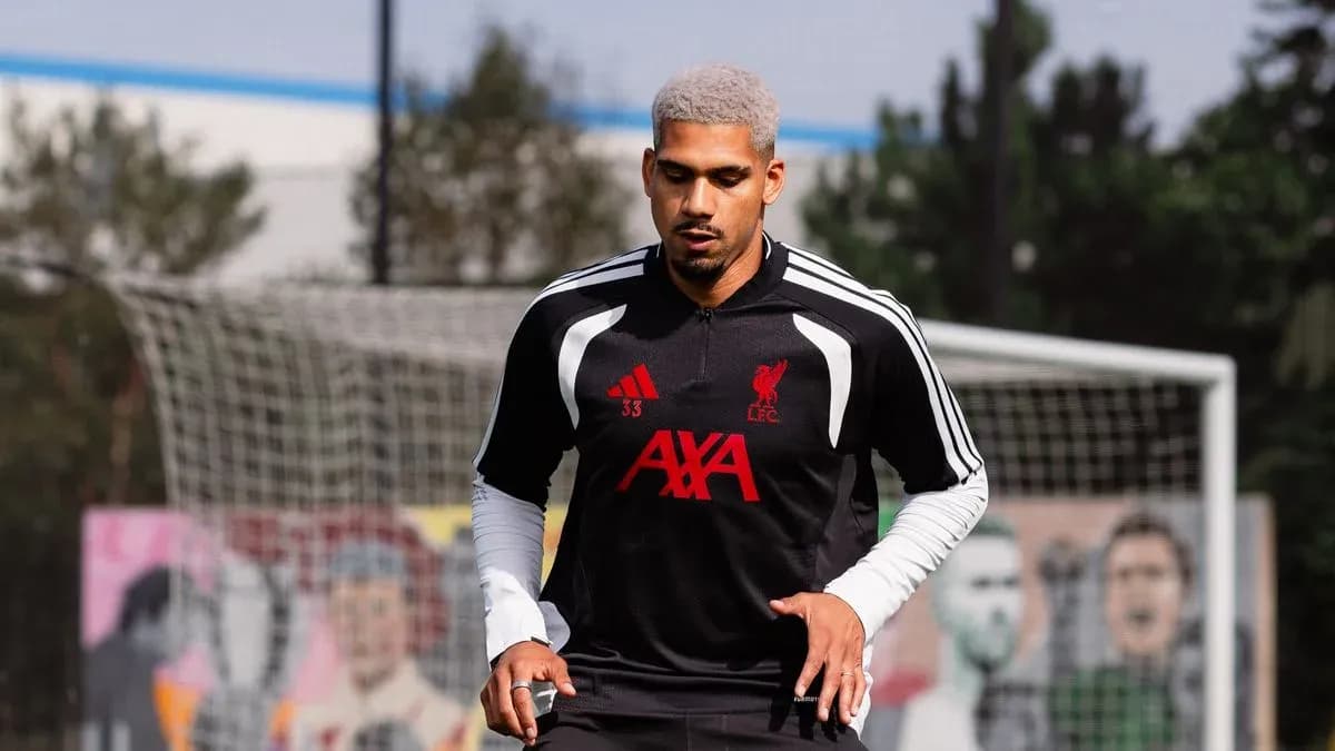 Player training on pitch with Liverpool FC kit Player training on pitch with Liverpool FC kit