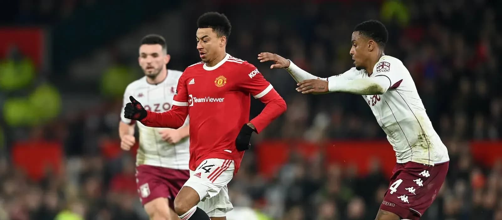 Jesse Lingard dribbling past Aston Villa defenders Jesse Lingard dribbling past Aston Villa defenders