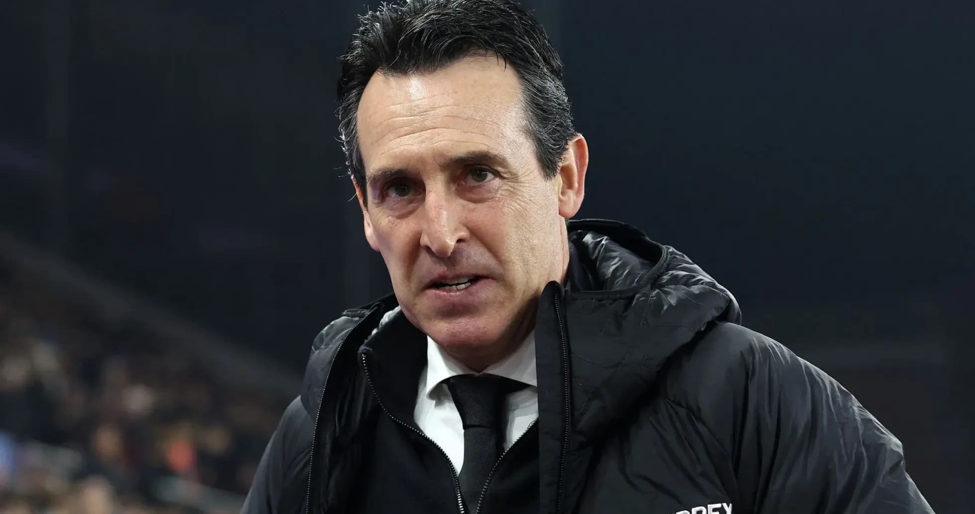 Coach in black jacket during match atmosphere Coach in black jacket during match atmosphere