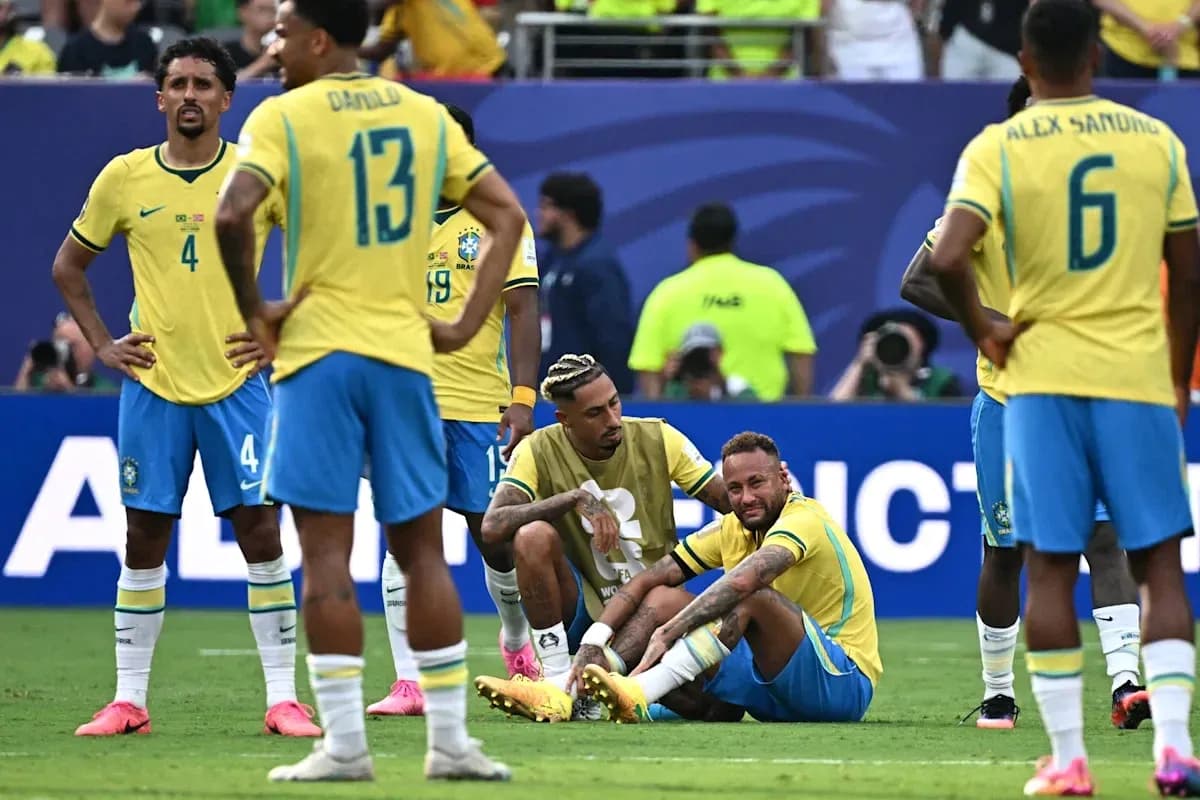 Neymar sitting on field with teammates during match Neymar sitting on field with teammates during match