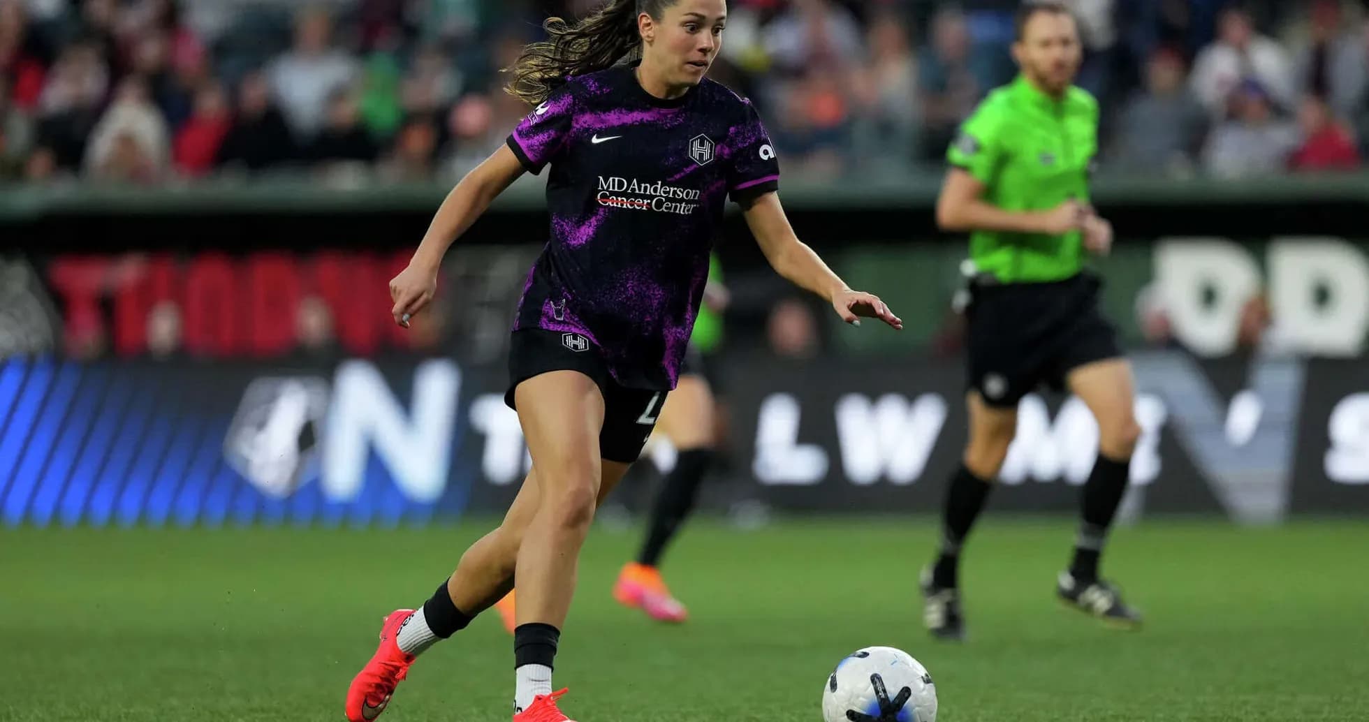Player dribbling ball during NWSL match Player dribbling ball during NWSL match
