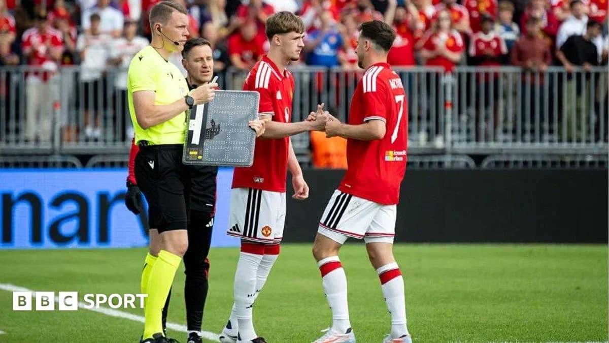 Players exchanging handshakes during substitution in match Players exchanging handshakes during substitution in match