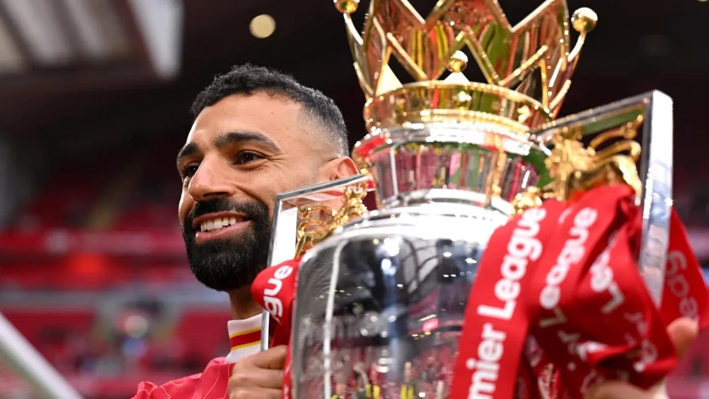 Player celebrating with Premier League trophy Player celebrating with Premier League trophy