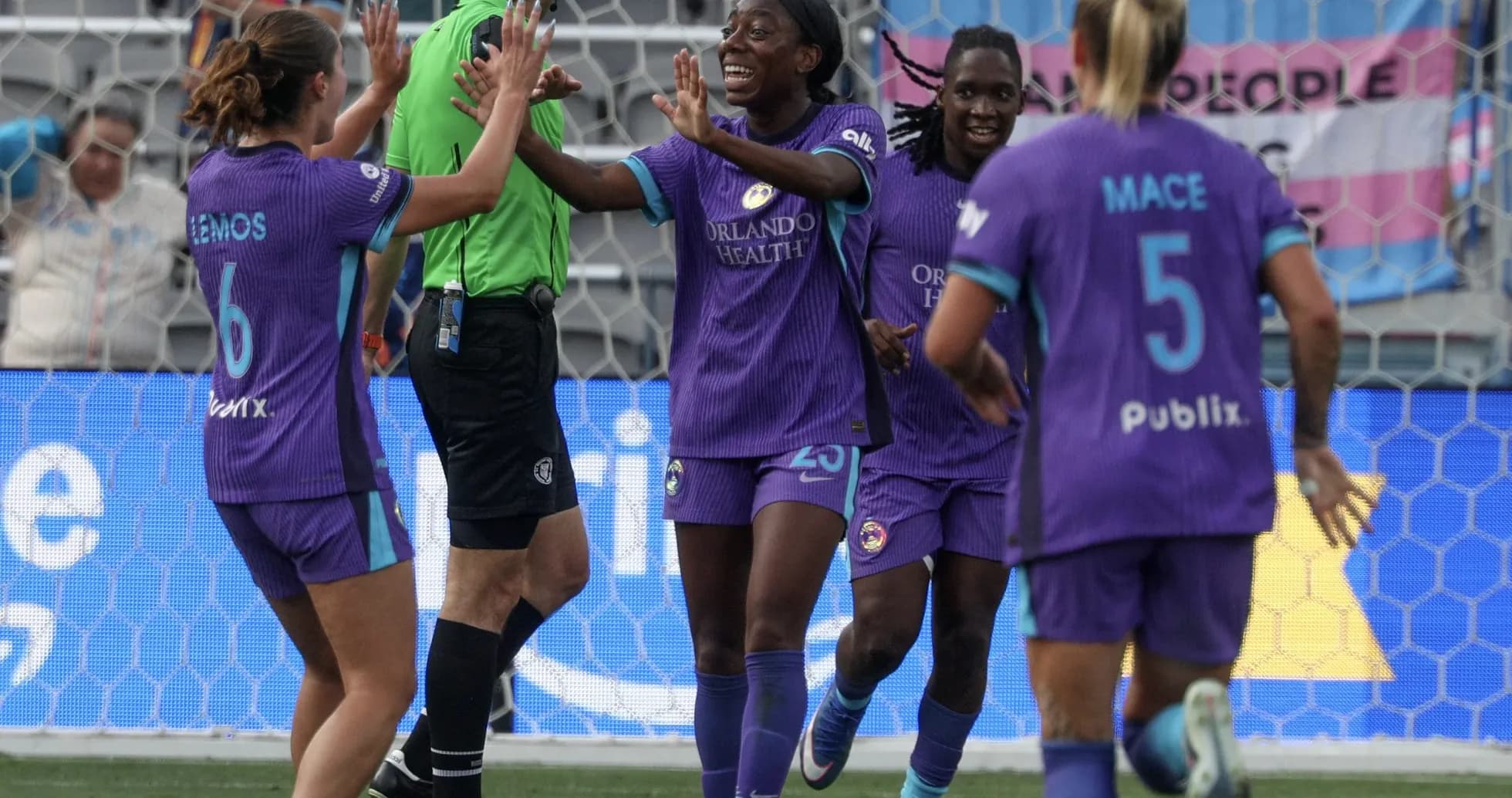 Orlando Pride players celebrating a goal Orlando Pride players celebrating a goal