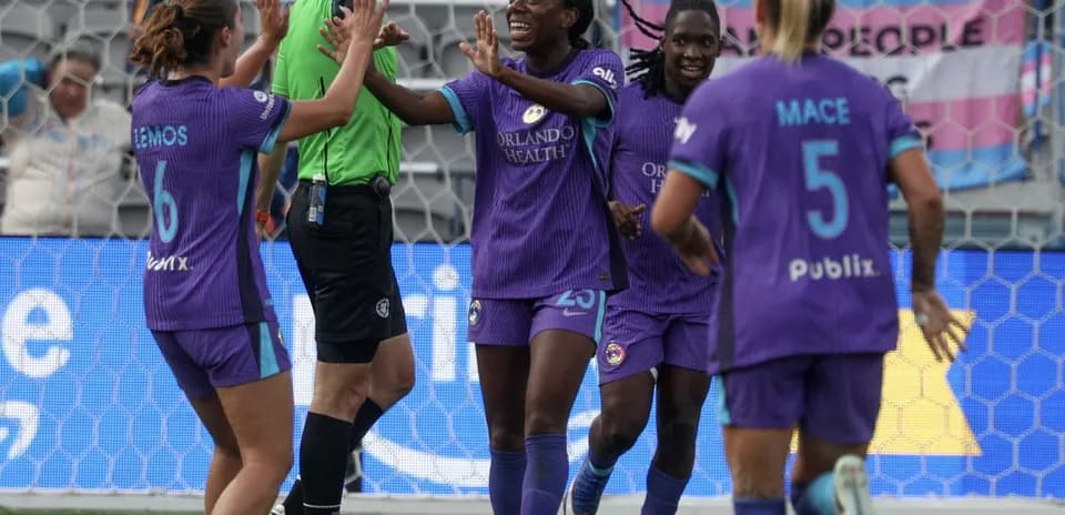 Orlando Pride players celebrating a goal Orlando Pride players celebrating a goal