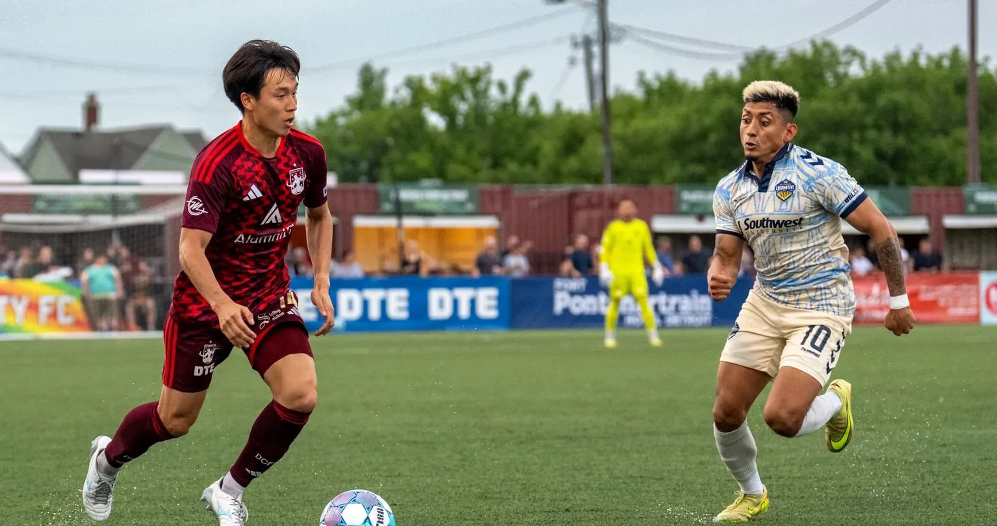 Players competing for the ball in USL match Players competing for the ball in USL match