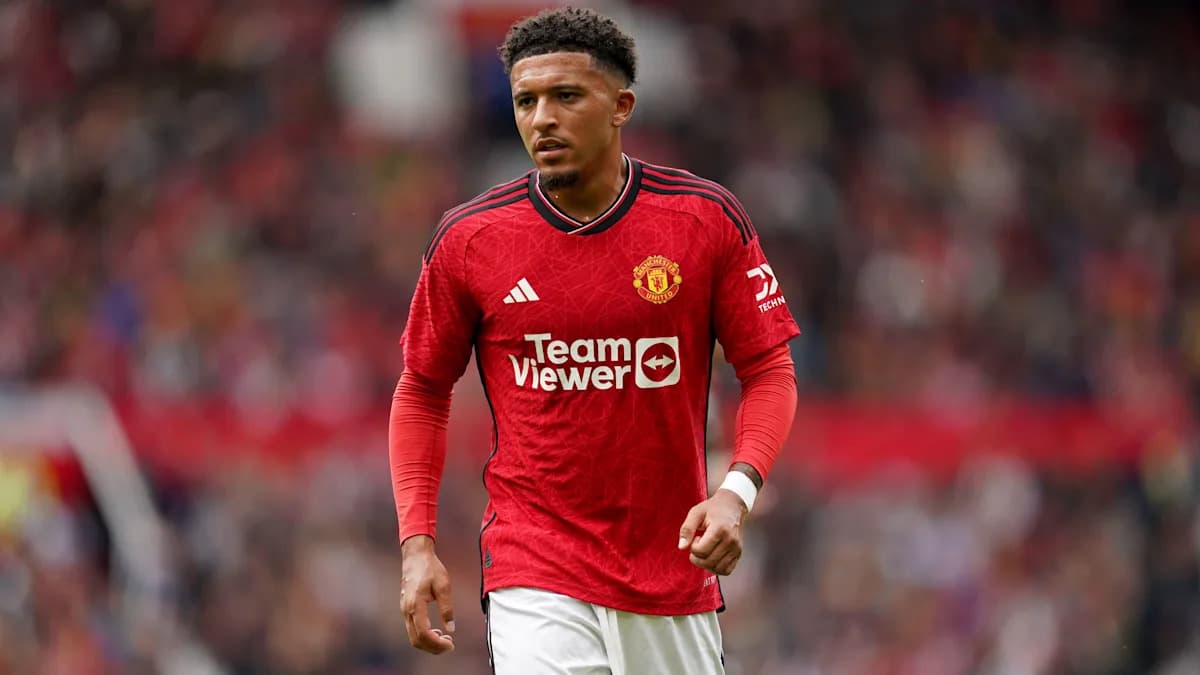 Player walking on pitch in Manchester United jersey Player walking on pitch in Manchester United jersey