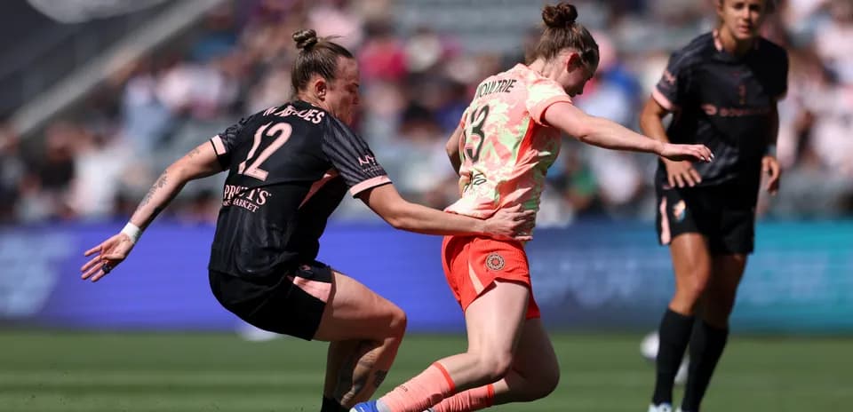 Portland Thorns player tackling Utah Royals opponent Portland Thorns player tackling Utah Royals opponent