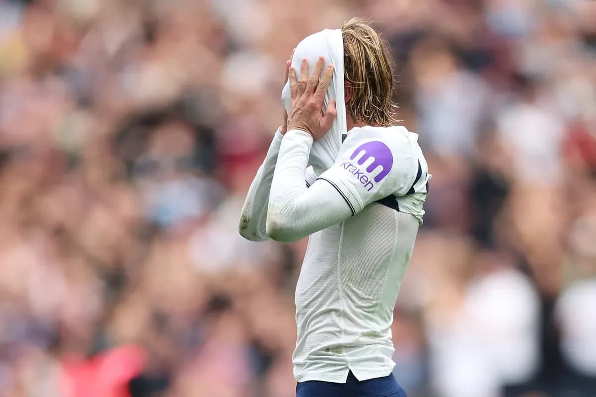 Player covering face with jersey during match Player covering face with jersey during match