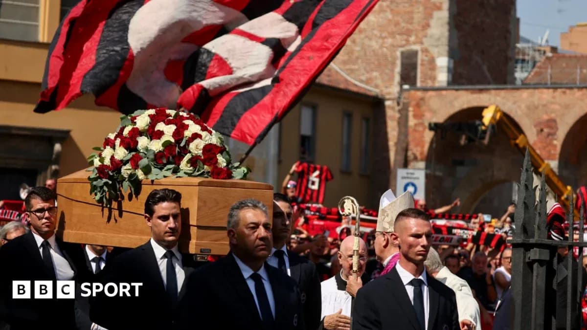 Funeral procession with coffin and supporters in background Funeral procession with coffin and supporters in background