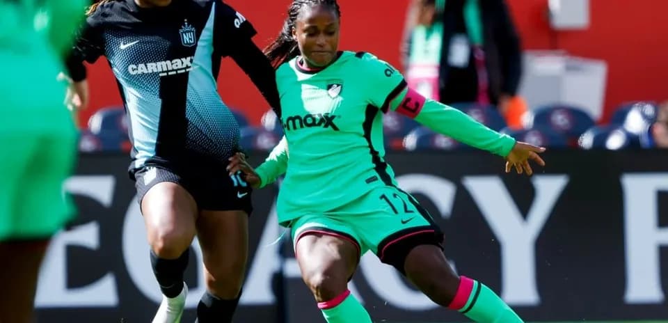 Players competing for the ball in NWSL match Players competing for the ball in NWSL match