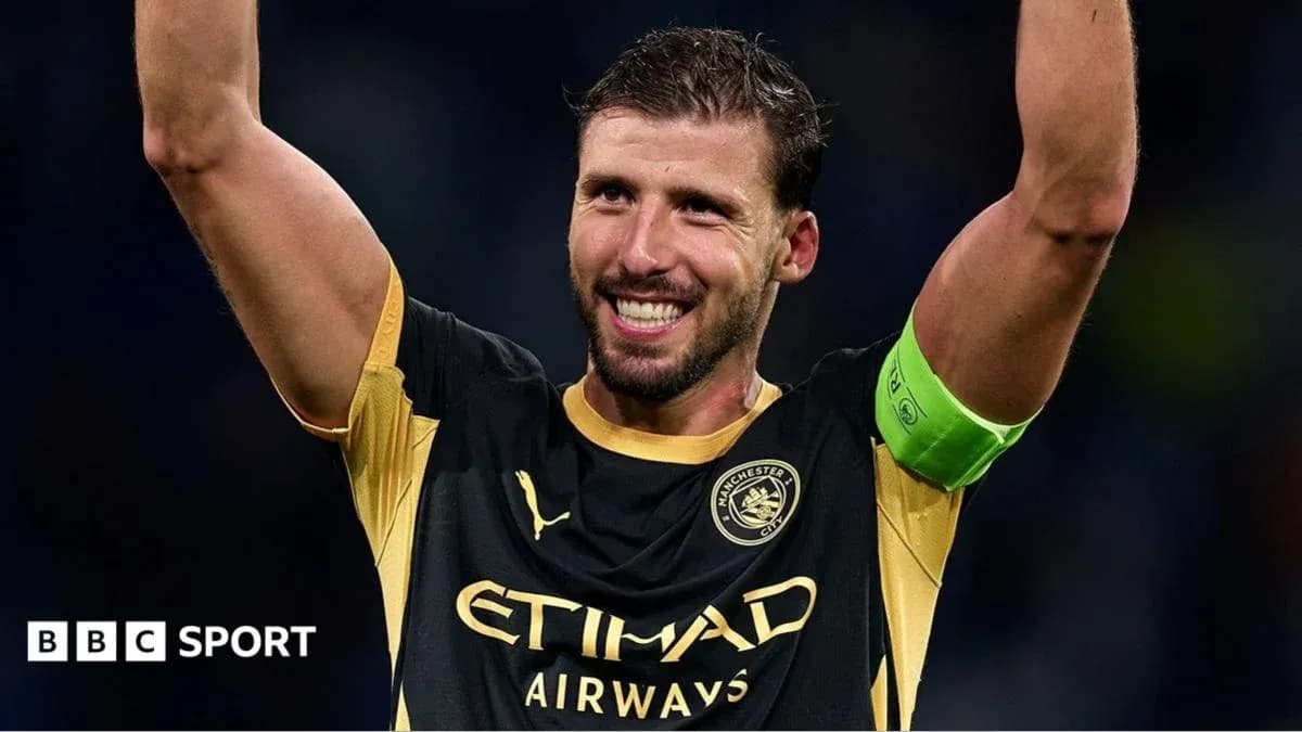 Player celebrating with raised arms wearing captain's armband Player celebrating with raised arms wearing captain's armband