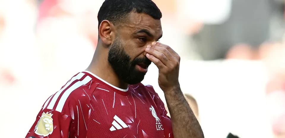 Player wiping brow during match on field Player wiping brow during match on field