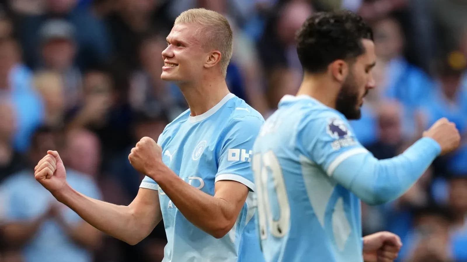 Erling Haaland celebrating a goal with teammate Erling Haaland celebrating a goal with teammate
