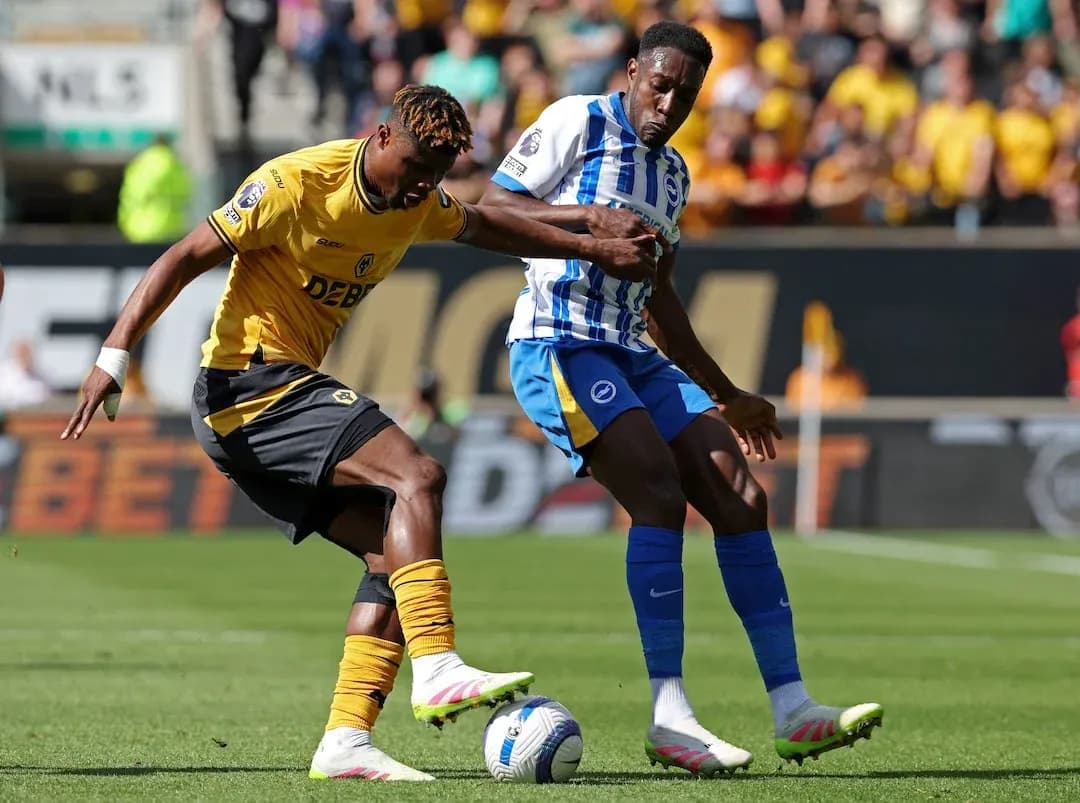 Brighton player tackling Wolves player during match Brighton player tackling Wolves player during match