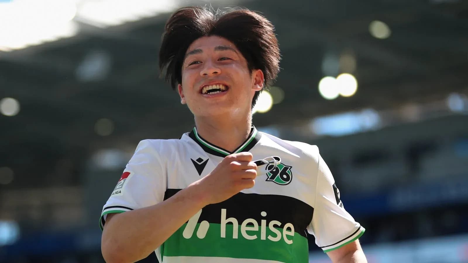 Player celebrating after scoring a goal on field Player celebrating after scoring a goal on field